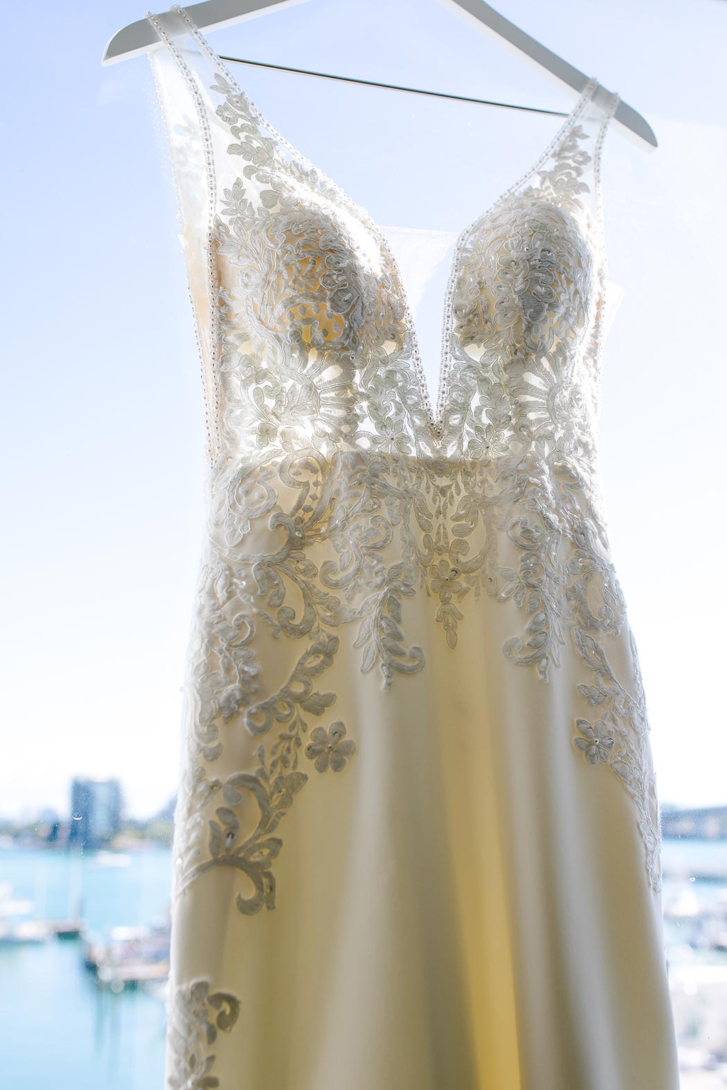 wedding dress photographed on window. coral gables congregational church wedding dress