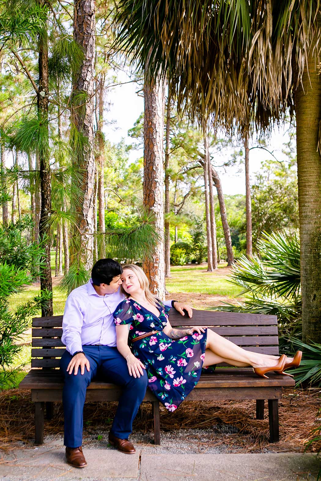unique posing for engagement couples sitting on wooden bench | couple sit on bench for engagement pictures | fort lauderdale engagement photography