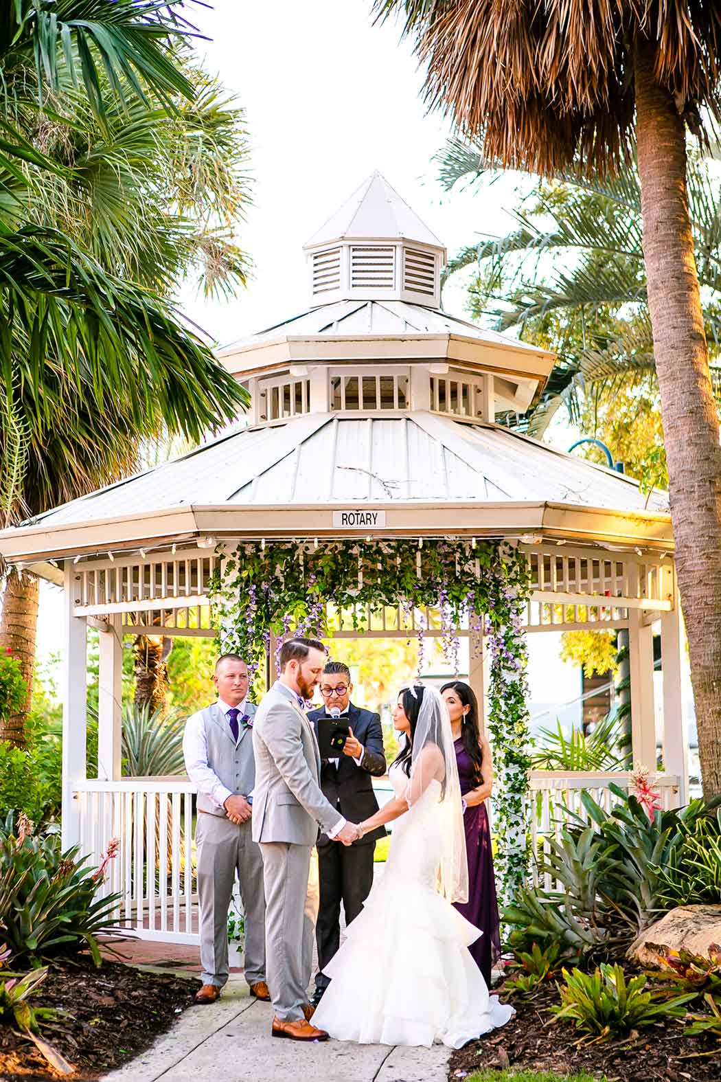 bride and groom at the alter | groom in grey suit with purple and white bow tie | beautiful fort lauderdale wedding