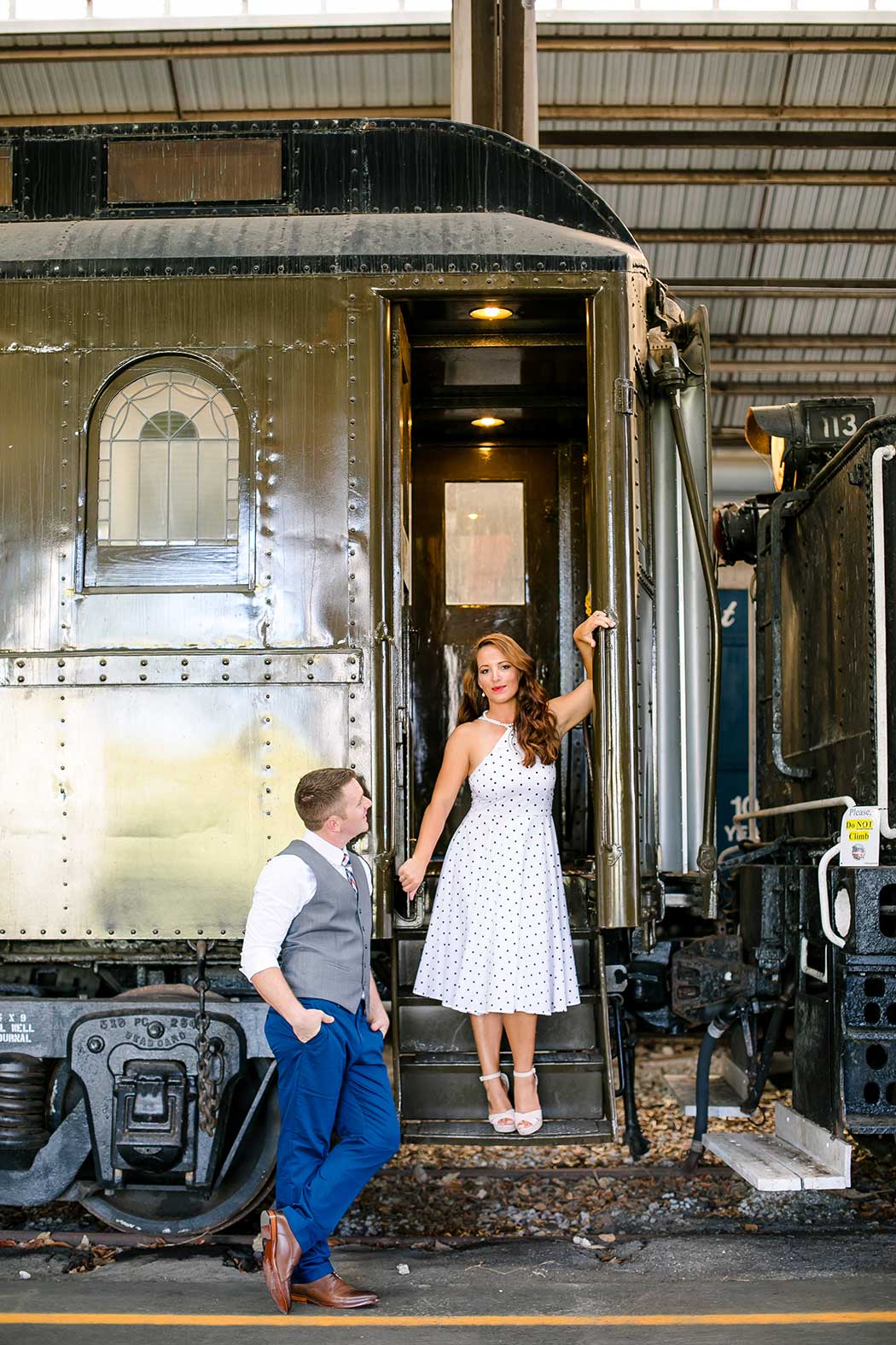 posing ideas on a train | engagement photography session at gold coast railroad museum miami | engagement photographer fort lauderdale