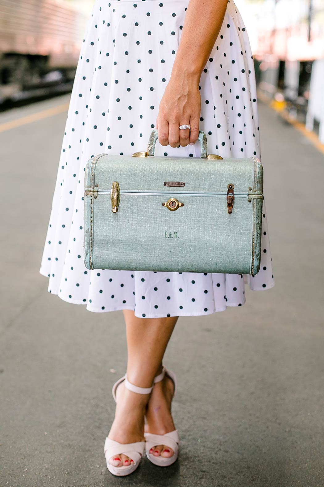 girl holding vintage suitcase for photoshoot | vintage luggage | vintage engagement session fort lauderdale | gold coast railroad museum engagement shoot 