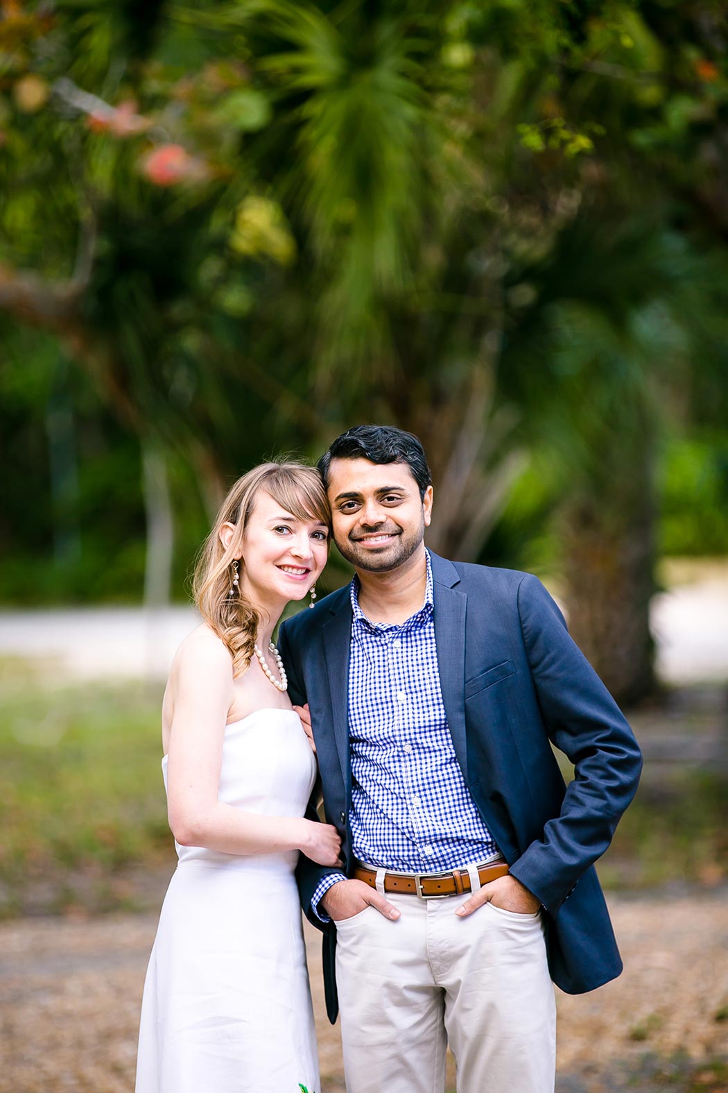 indian man and american woman embrace for fort lauderdale engagement photoshoot