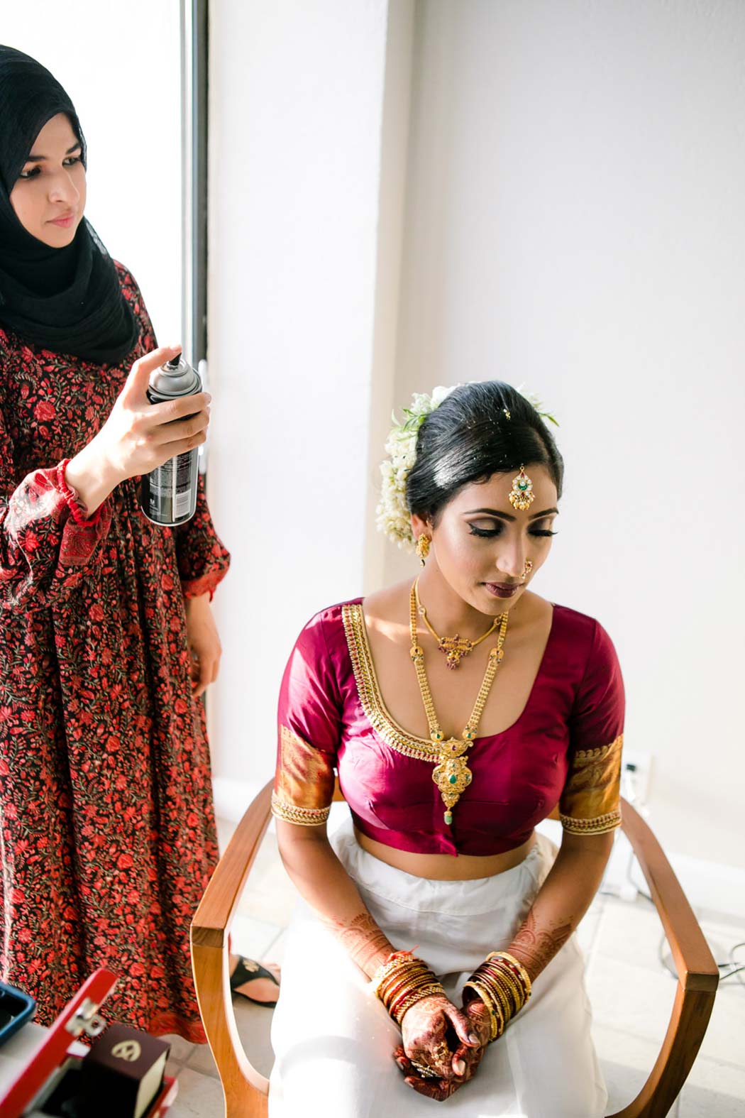 indian bride gets married in bahia mar fort lauderdale wearing gold and red sari