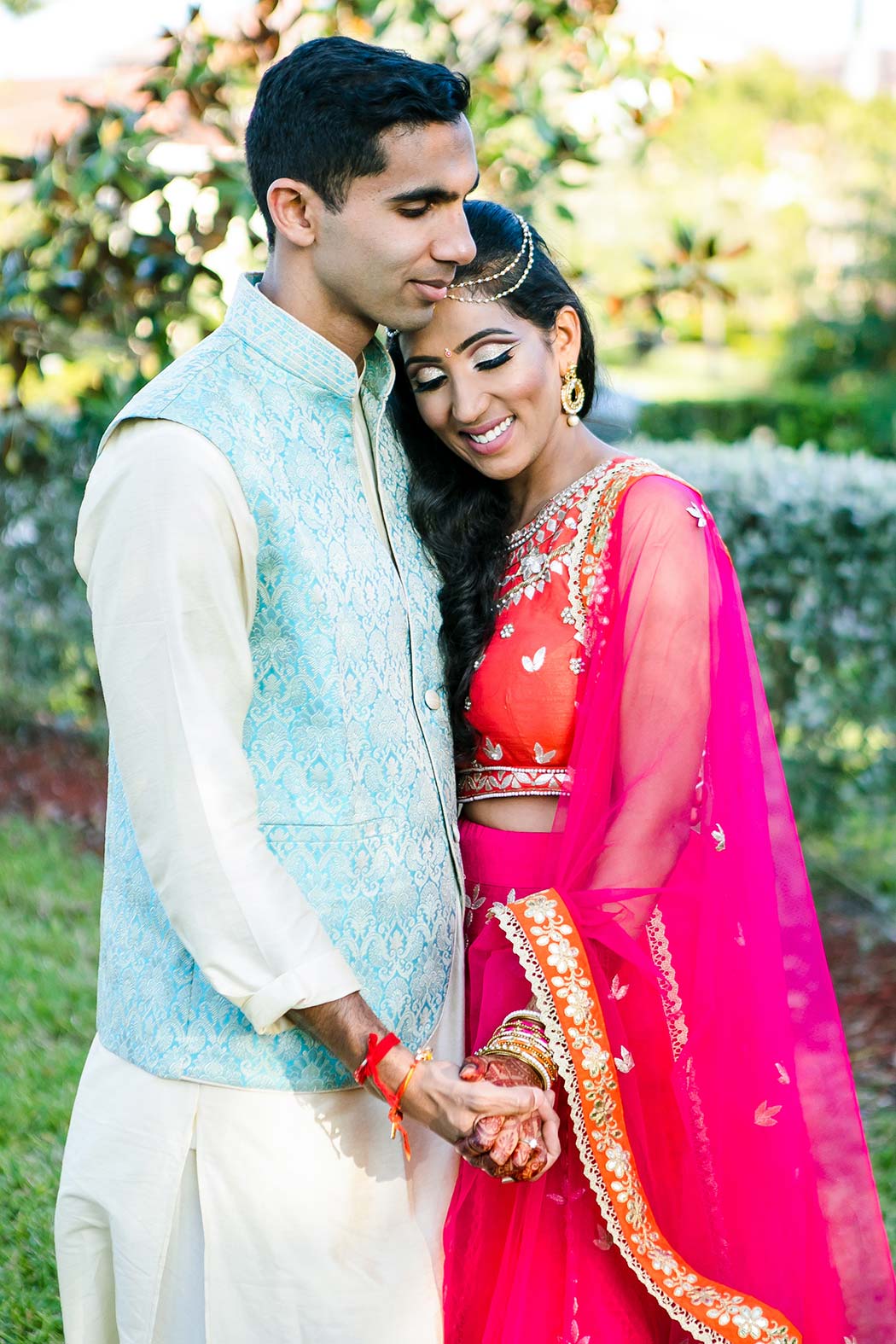 indian bride and groom pose for wedding photographs in fort lauderdale