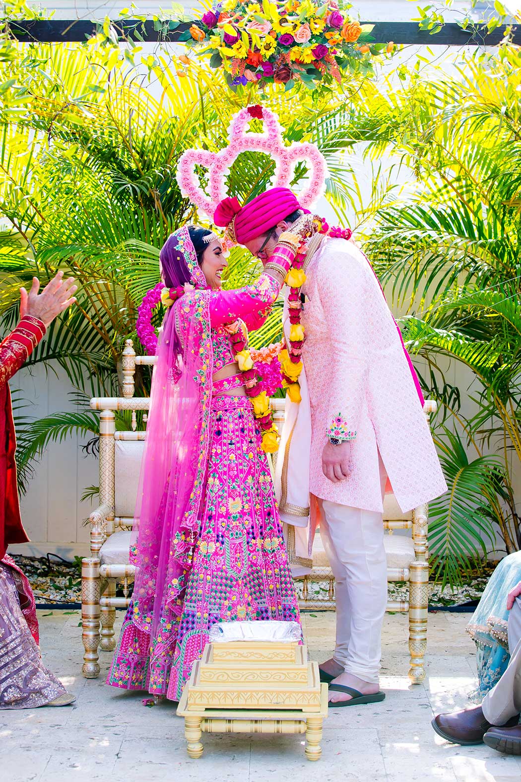 indian bride and groom get married in fort lauderdale | indian bride puts floral garland on husband