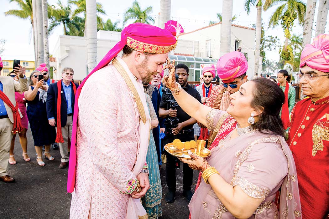 indian groom milni procession | groom and brides mother photograph | fort lauderdale indian wedding
