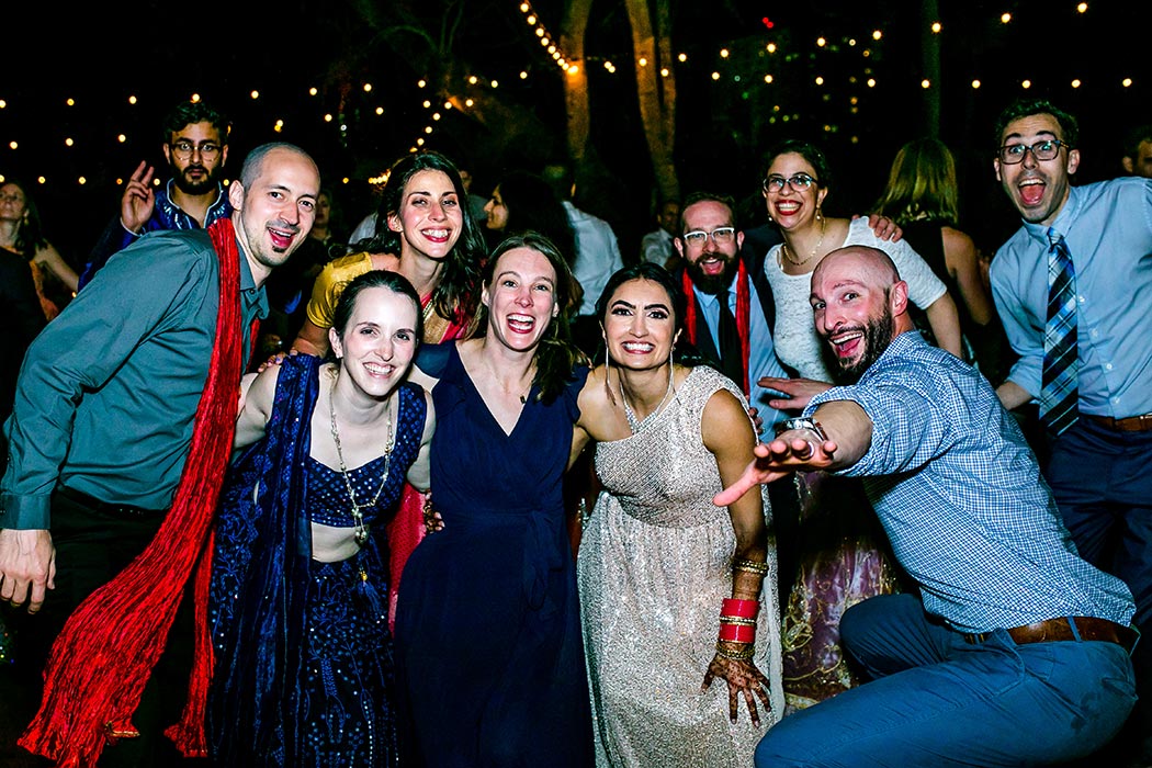 friends pose for wedding picture during south florida indian wedding photography