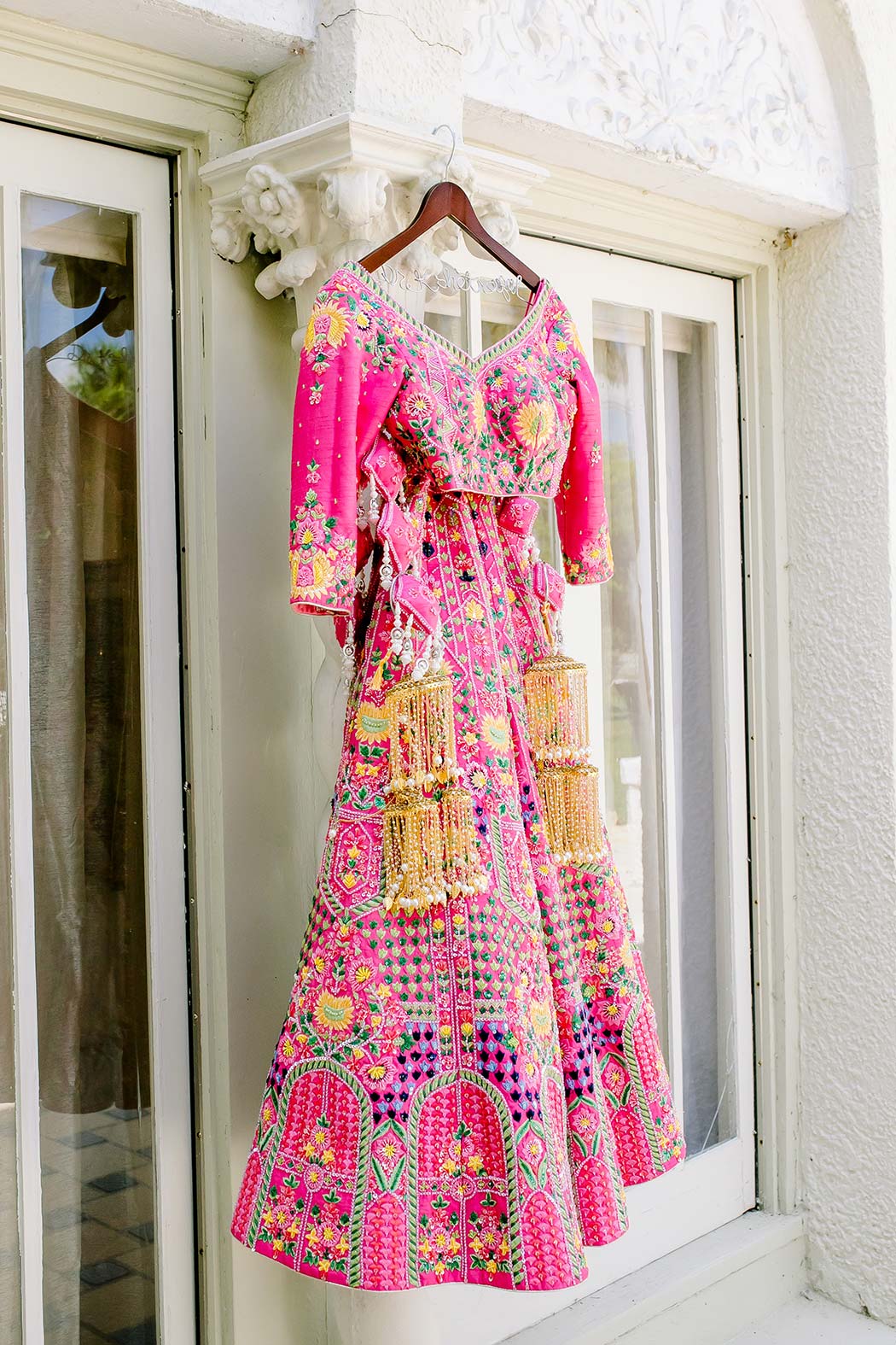 indian wedding sari photograph | sari hanging from building | indian wedding at Alderman House | Fort Myers Indian wedding photography