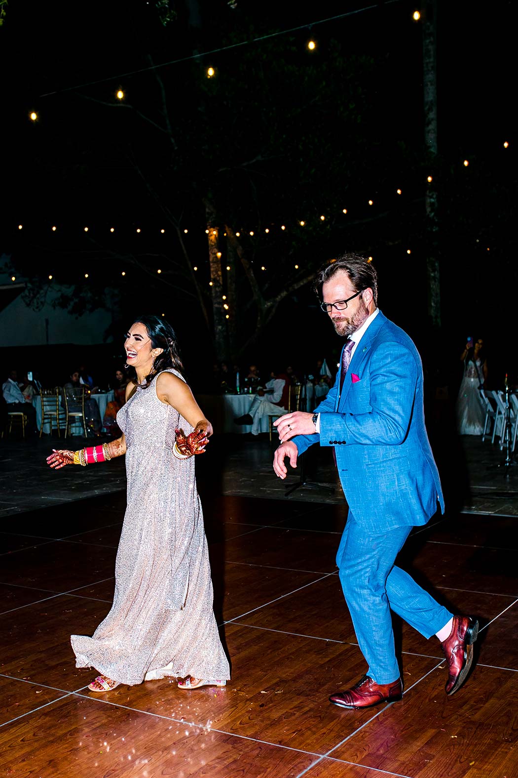 indian bride and groom first dance at wedding | indian bride wears gold sequenced gown | first dance at indian wedding