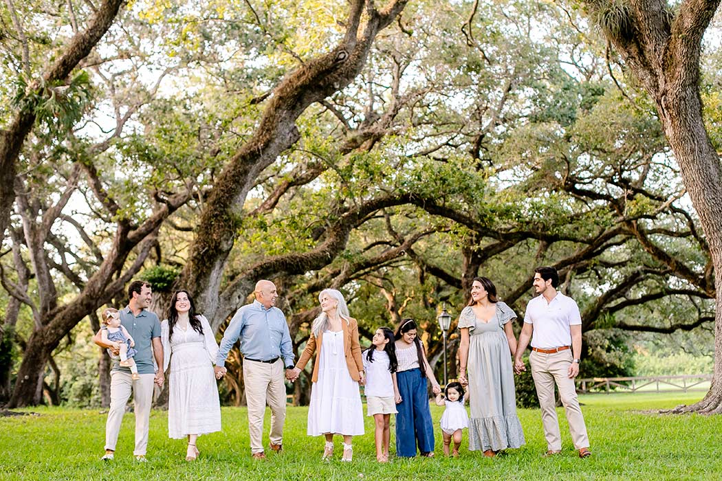 family holding hands walking on beach during photoshoot | family photography walking poses | family walk pose photography | fort lauderdale photographer | fort lauderdale family photographer