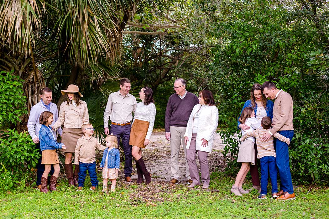 Large extended family photoshoot all having fun in robbins preserve davie