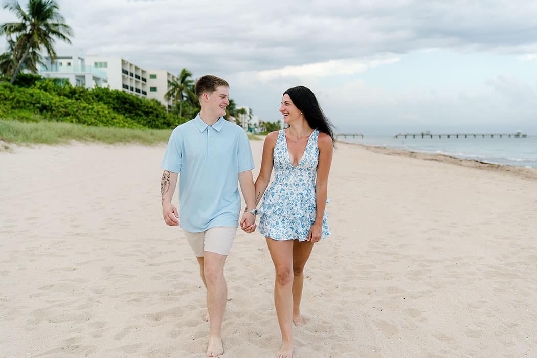 couple walking on beach after surprise fort lauderdale beach proposal
