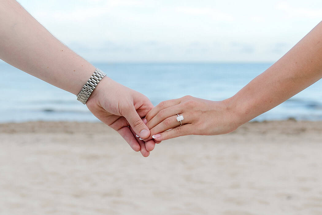 couple show their new engagement ring after surprise fort lauderdale beach engagement