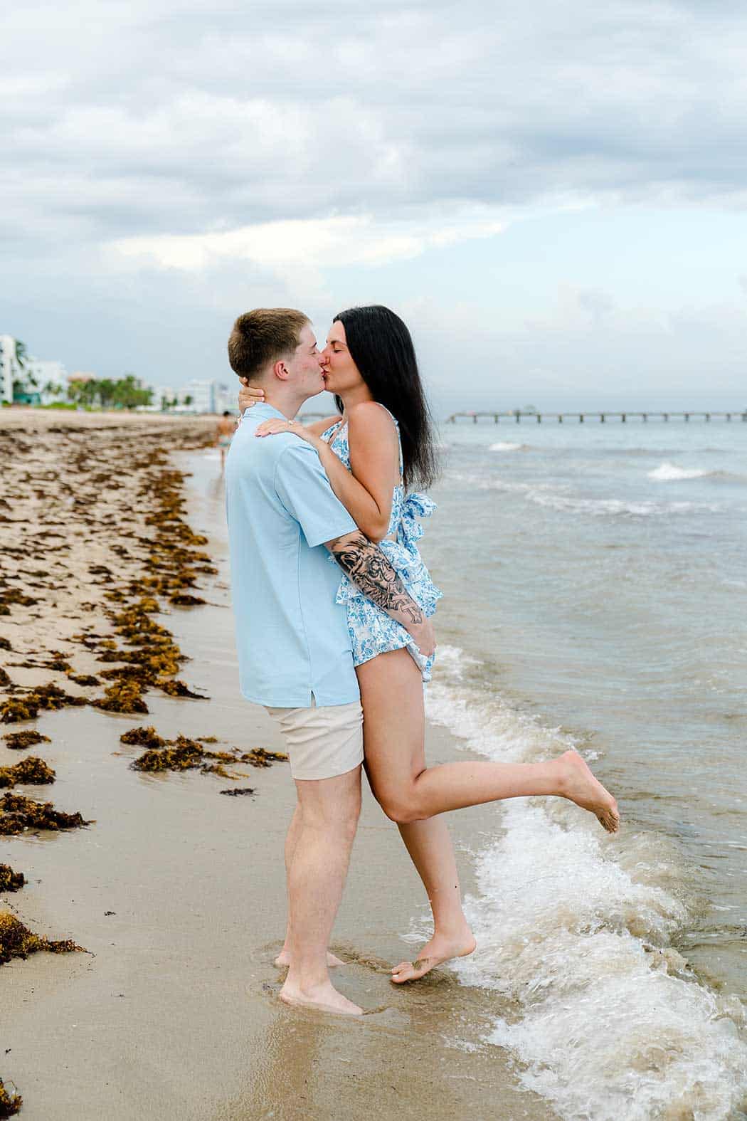 Newly engaged couple embracing after a romantic Fort Lauderdale Beach proposal